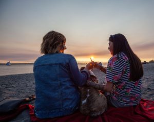 Phone addiction promptly stopped by a joint passing between two friends